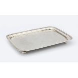 A rectangular 835 silver tray with reeded border on four ball supports, maker's mark: Pieter