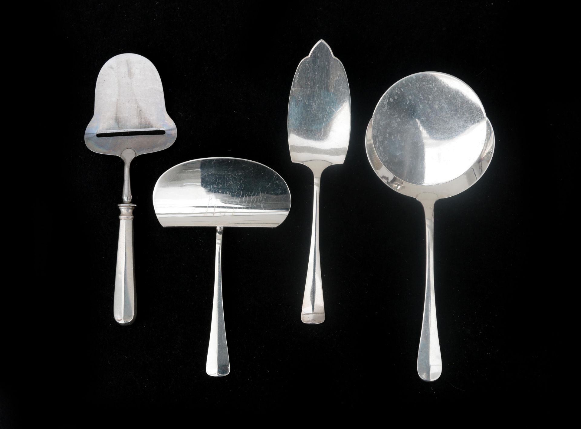 Four Dutch silver serving spoons, model Haagslofje, consisting of a croquette shovel, a cheese