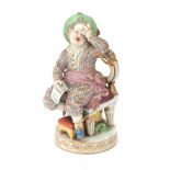 A polychrome porcelain Meissen figurine of a naughty boy who is tied to his chair in order to get