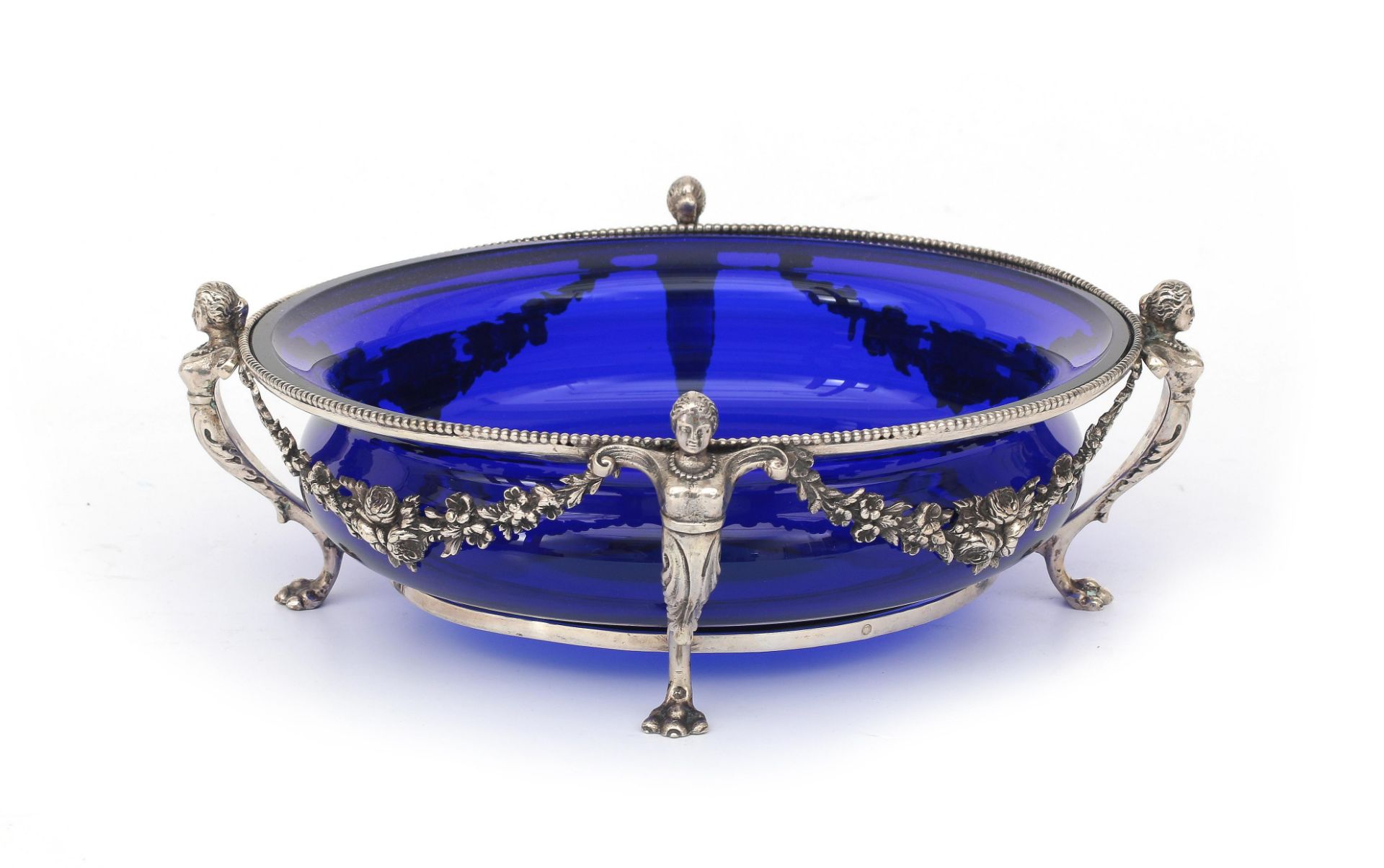 A large 835 silver dish with cobalt blue glass liner, decorated with flower festoons, and a beaded