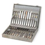Twelve partially gilded fruit forks and fruit knives with 835 silver handles in case, adress: Roelof