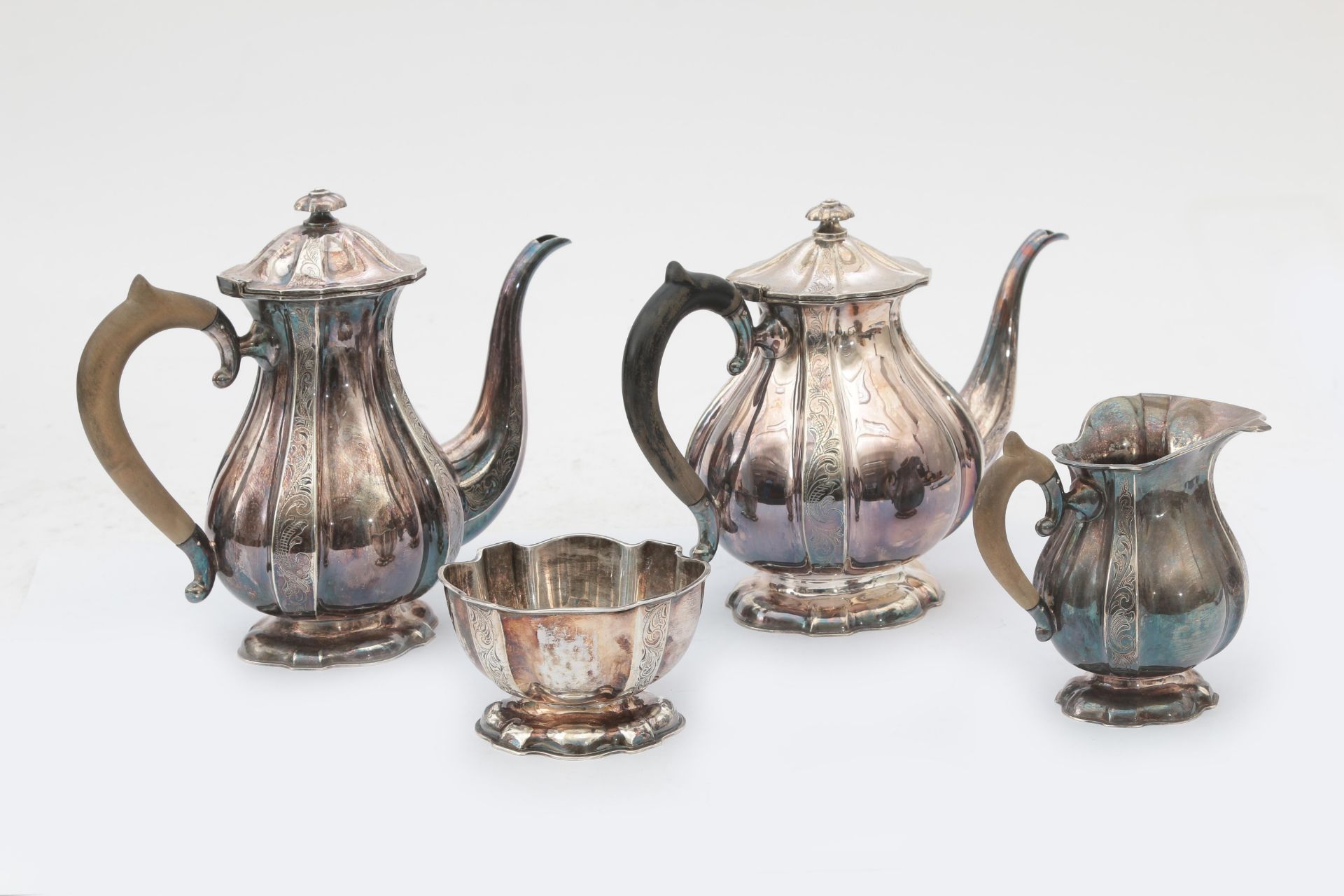 A four piece 835 silver tea, coffee service with engraved foliate decoration, comprising a teapot,