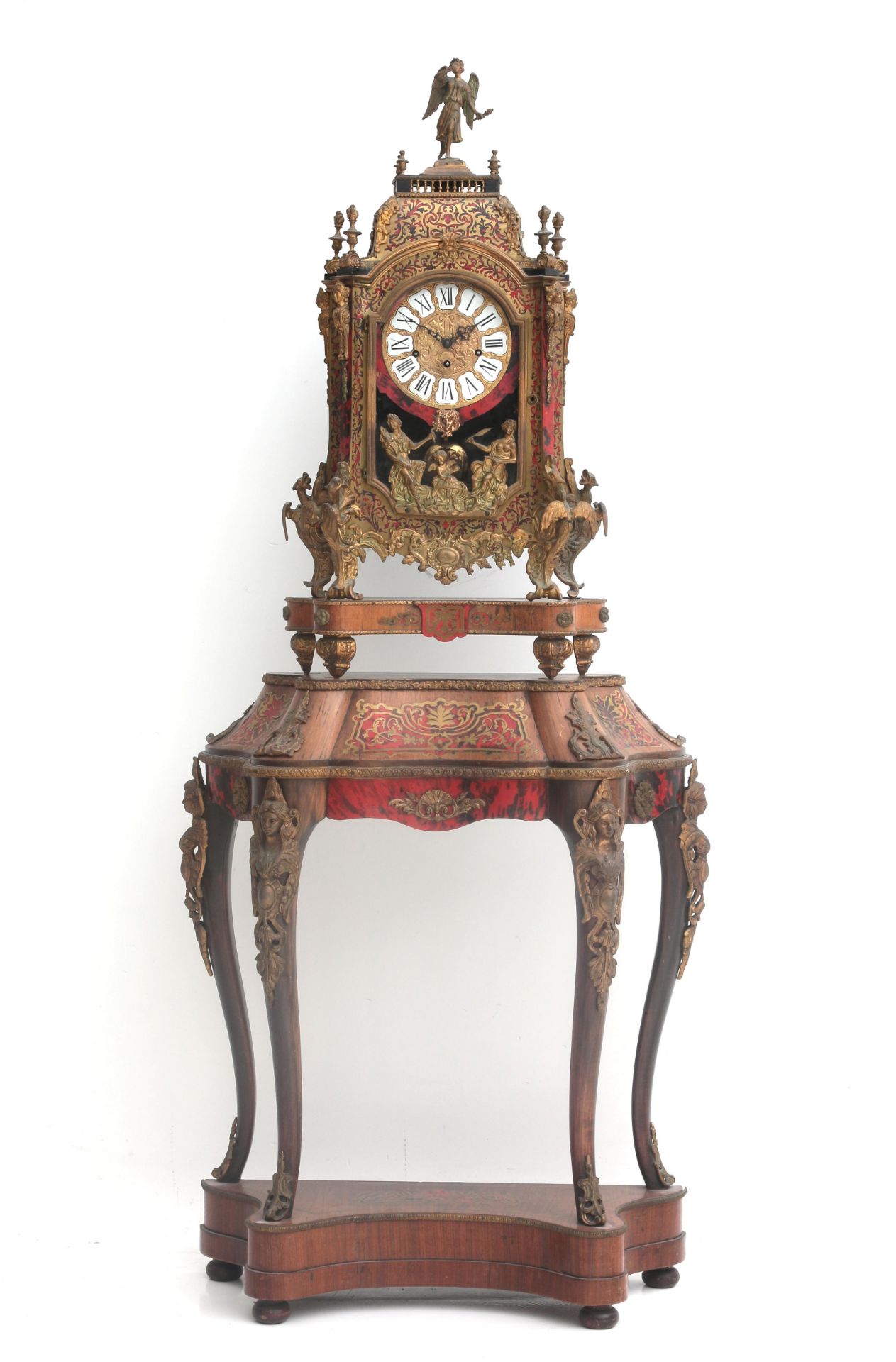 A large Boulle-style table clock with stand, France, 19th century. The case crowned with an angel (