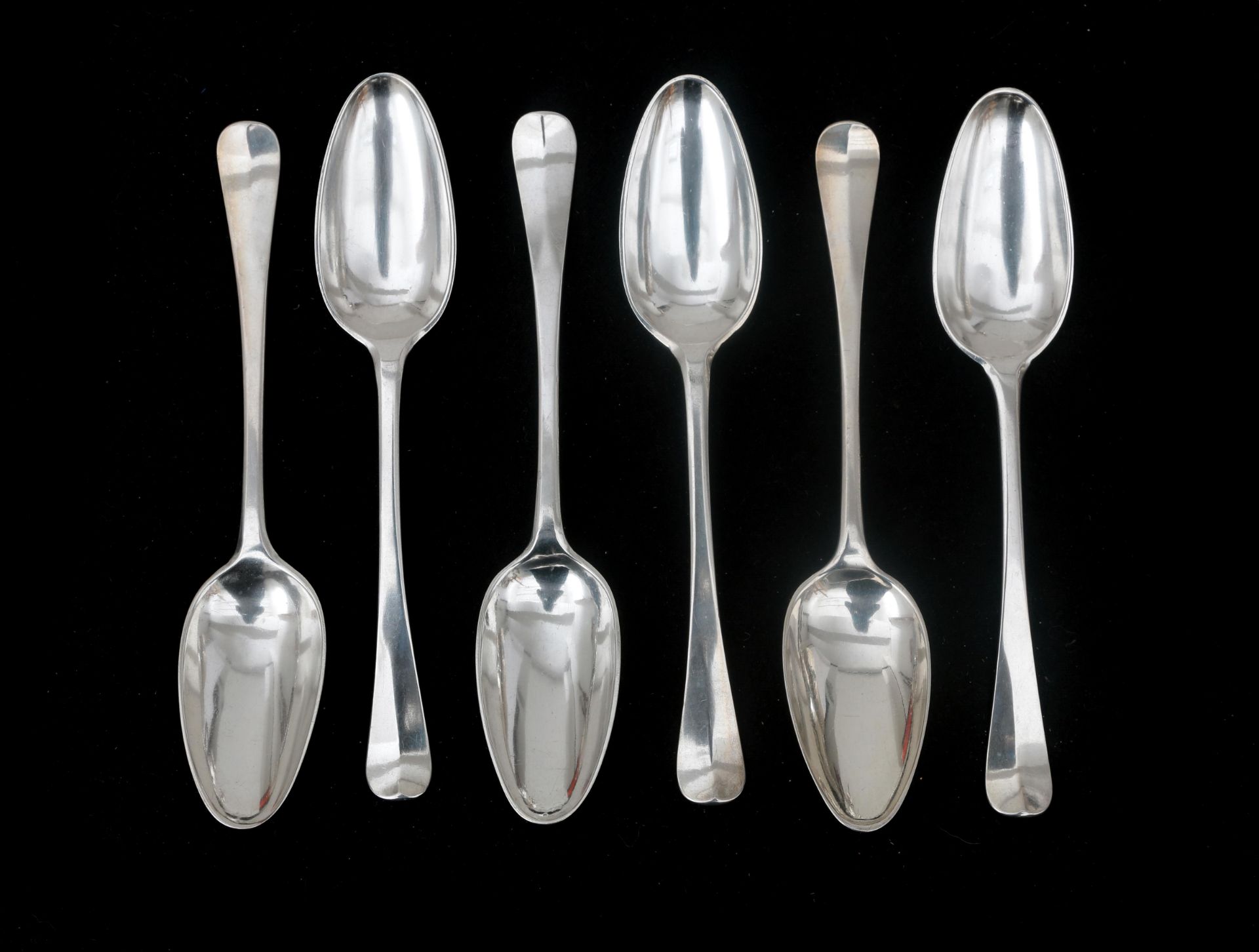 Six silver table spoons 19th century, on five of the six spoons beaten with the ax for returning