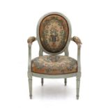 A Louis XVI armchair, France, late 18th century. The woodwork grey painted, the back and seat with