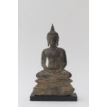 Bronze Buddha from the surroundings of Ayuthia, Thailand. The head crowned with tall ushnisha, the