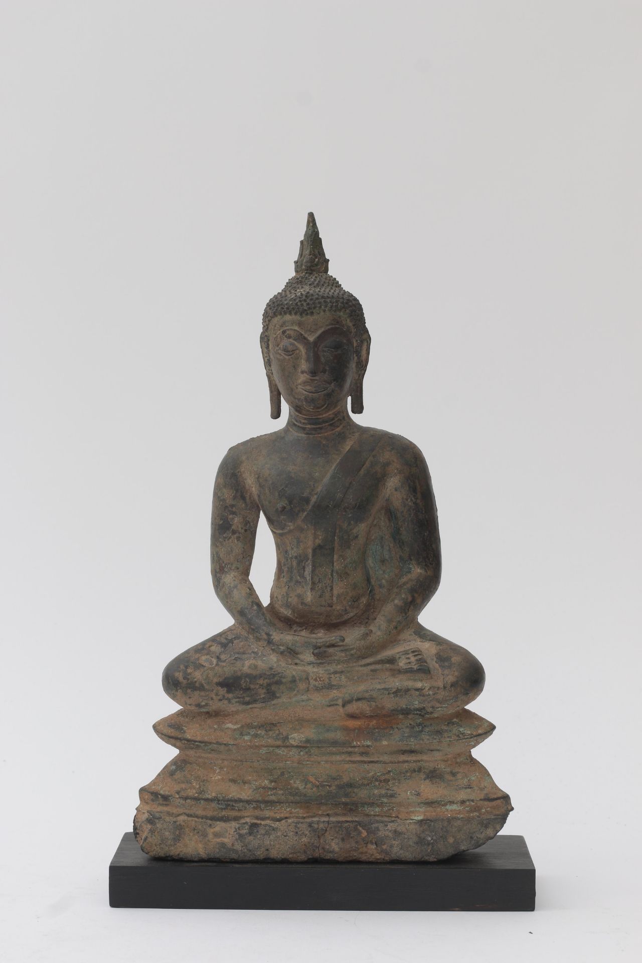 Bronze Buddha from the surroundings of Ayuthia, Thailand. The head crowned with tall ushnisha, the