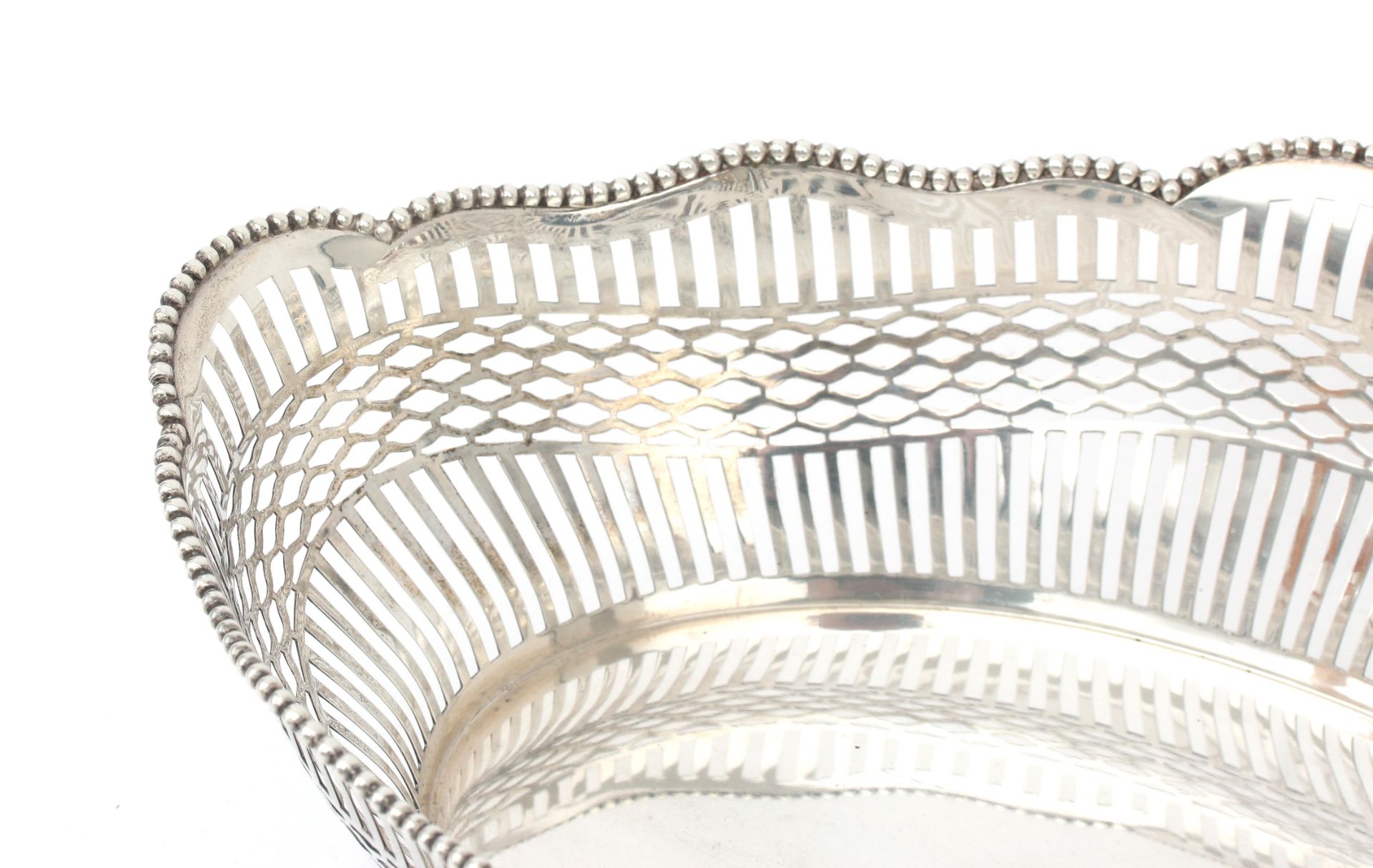 A pierced 835 silver bread basket with beaded border on base, maker's mark: van Kempen & Begeer, - Bild 2 aus 3