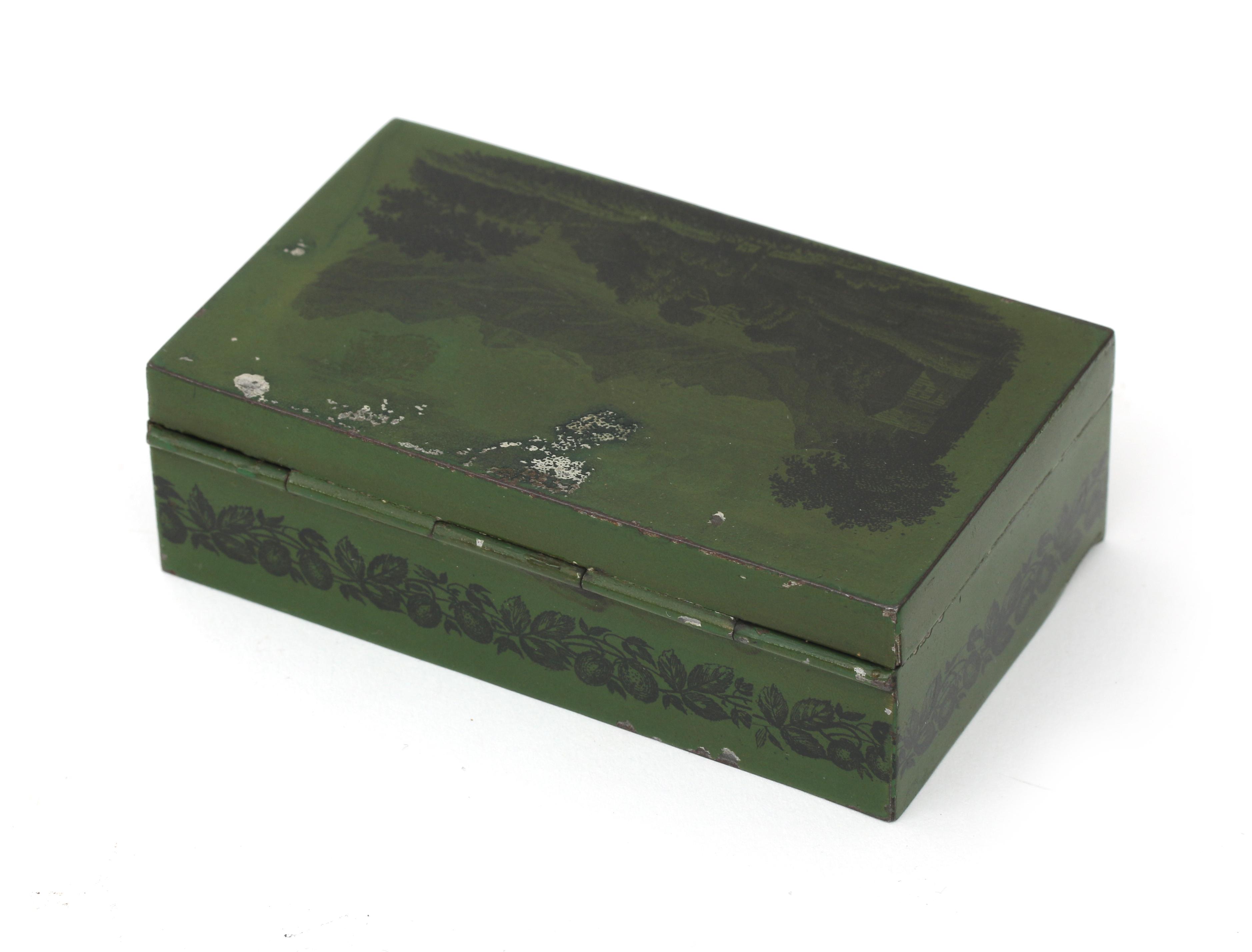 A Swiss souvenir cylinder music box in green tin case decorated with a landscape with the text: - Image 4 of 4