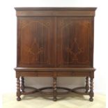 A rosewood veneered cabinet, Dutch, ca. 1700. Under a profiled architrave a double door and