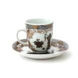 Encre de Chine cup and saucer with a decoration of objects for good fortune in black and gold,