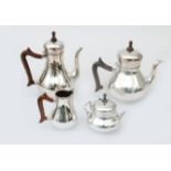 A four-piece sterling silver tea and coffee set, consisting of: a coffee pot, teapot, milk jug and