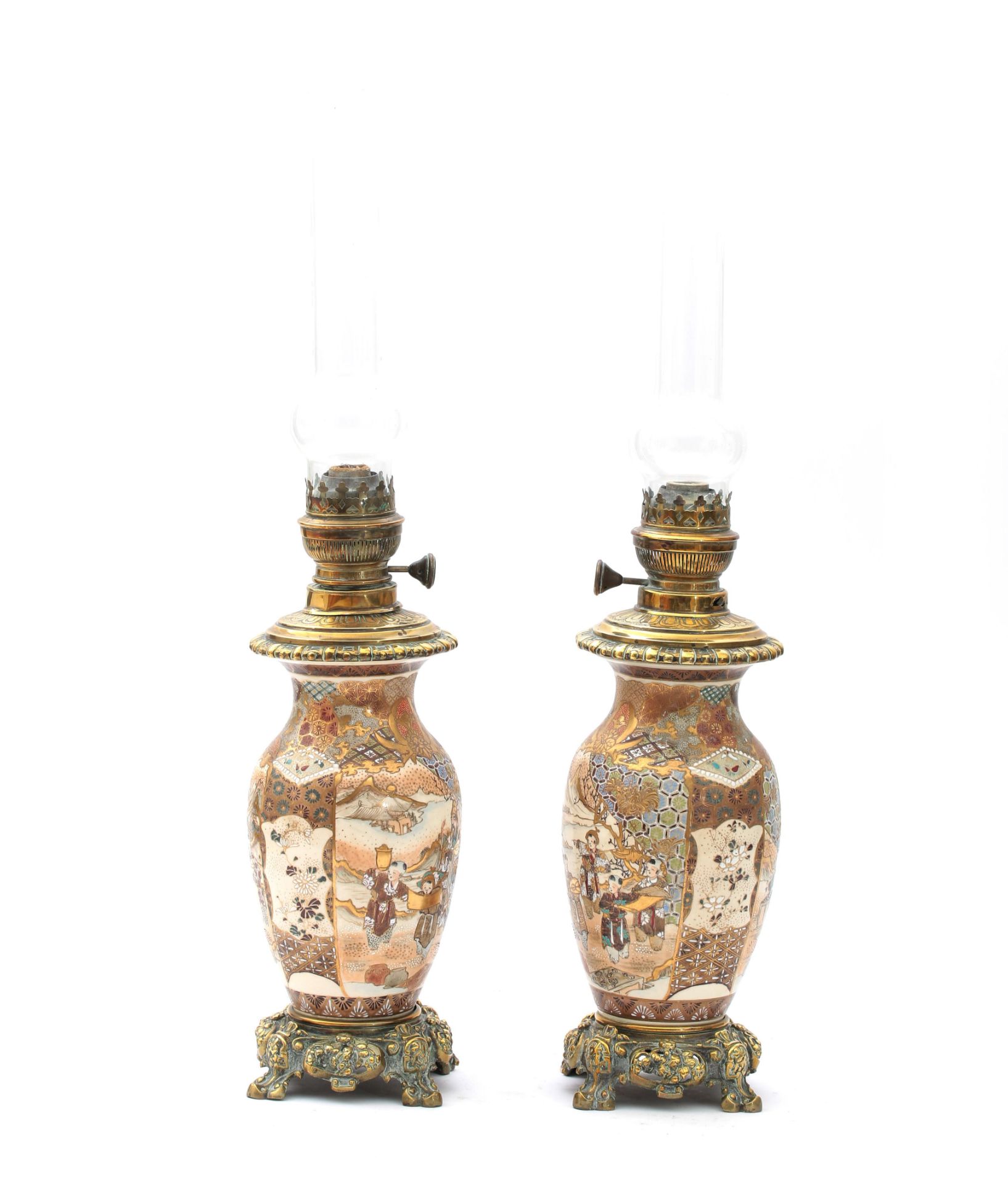 A pair of Japanese Satsuma and bronze mounted oil lamps, decorated with a family in a garden, circa