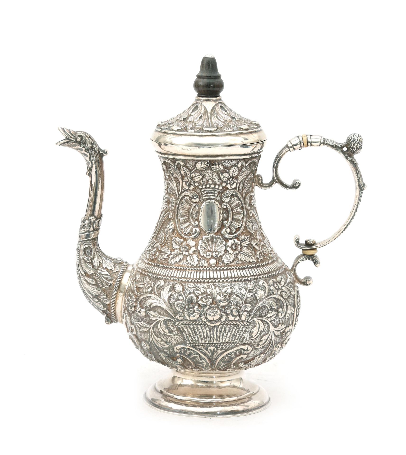 A richly decorated embossed Frisian silver mocha pot with foliate motifs and palisander finial.