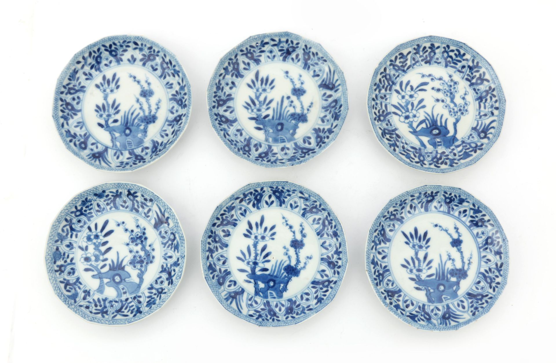 Six Chinese porcelain dishes, decorated with foliate motifs and blosom branches, Kangxi period,