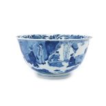 A Chinese blue and white porcelaine bowl decorated with scholars in a garden, marked with a six-