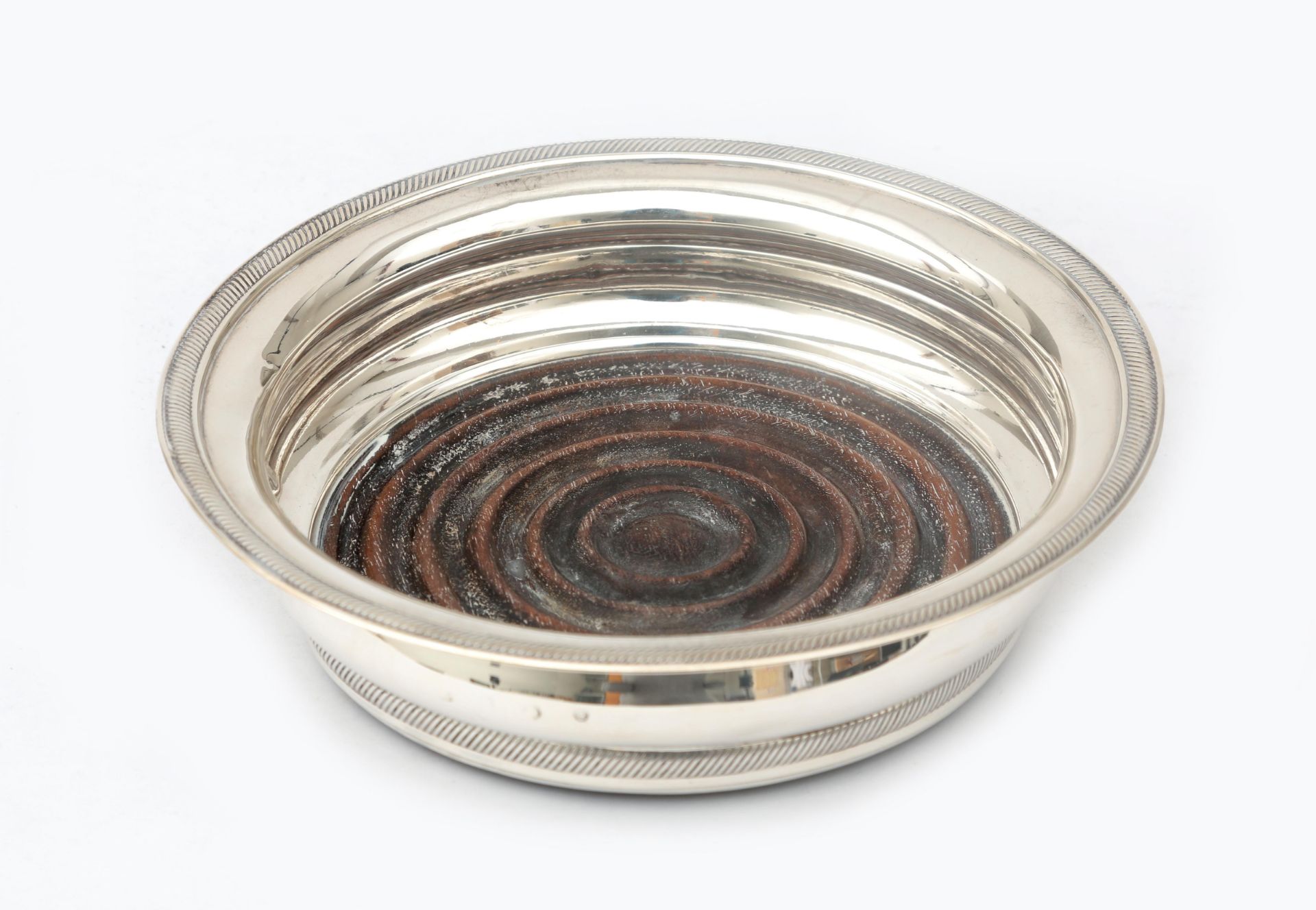 A second grade Dutch silver wine tray, with wooden bottom, top and bottom edge finished with a cord