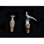 A pair of silver decorative corks, one with a miniature silver pheasant, this one sterling silver,