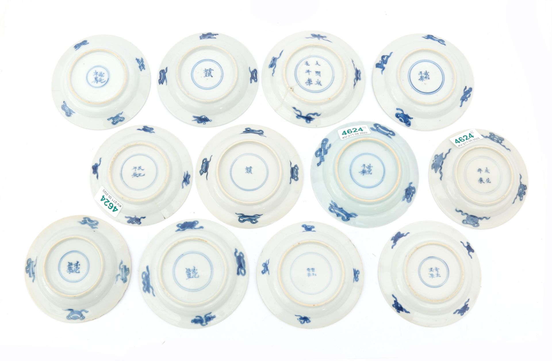 Twelve Chinese porcelain dishes, decorated with a playing child and a woman in a garden in Kangxi- - Image 2 of 4