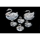 A set of a pair of swans with four smaller swans, crystal dishes with silver mounts, signed with