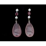 A pair of 18 karat white gold earrings set with rose quartz, ruby and diamonds