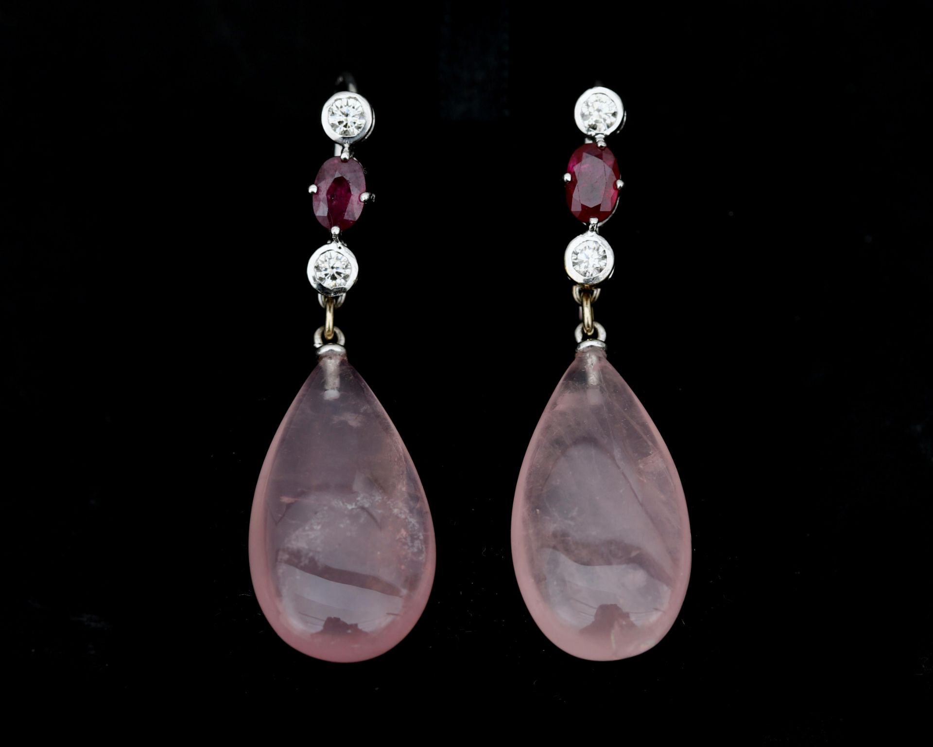 A pair of 18 karat white gold earrings set with rose quartz, ruby and diamonds 