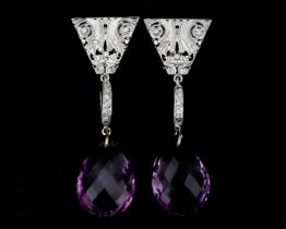 A pair of 18 karat white gold earrings set with diamonds and amethist 