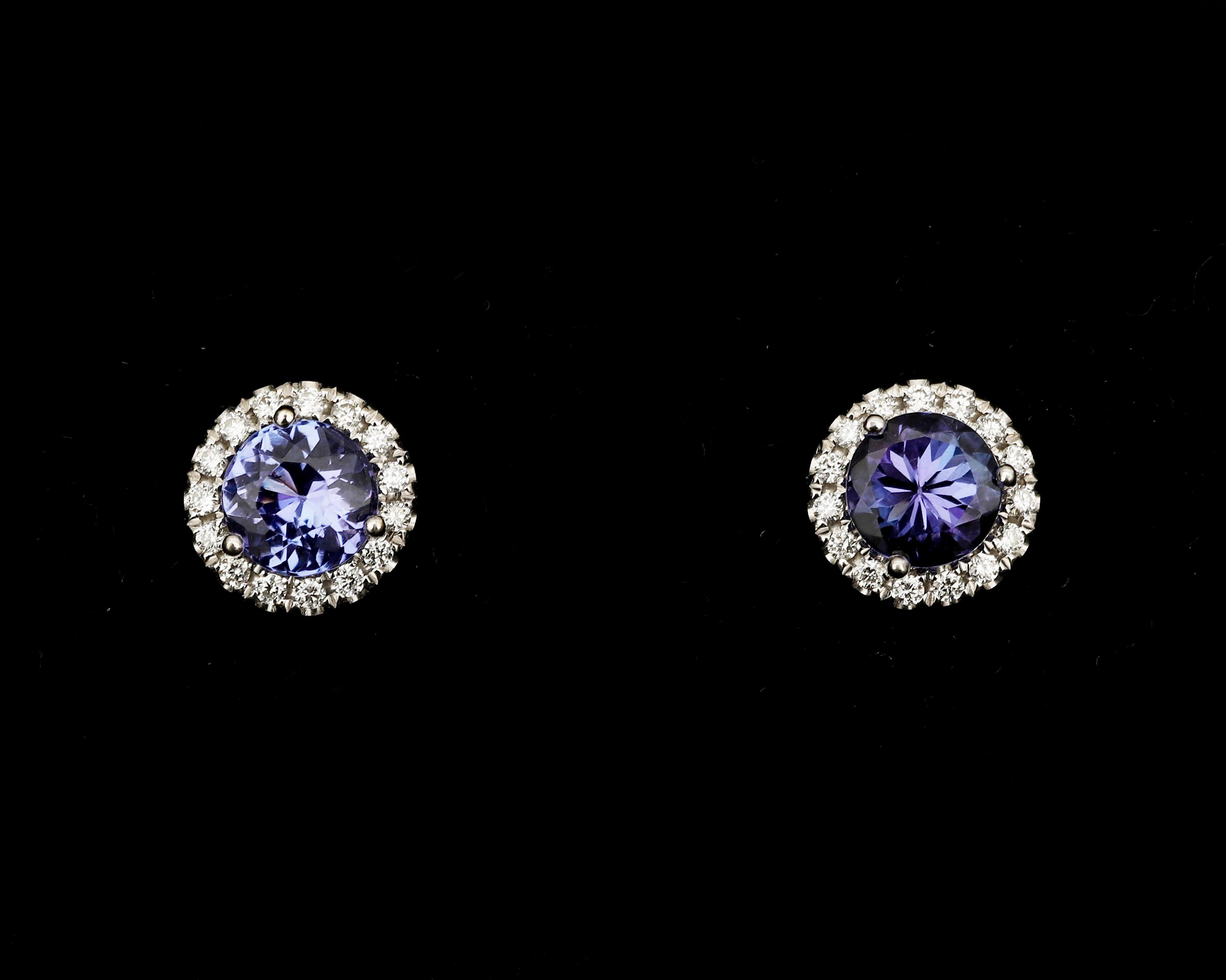 A pair of 18 karat white gold rosette stud earrings, with Tanzanite and diamonds