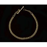 A 14 karat gold watch chain with stick lock