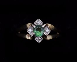 A 14 karat gold ring, with green Tourmaline and Diamonds