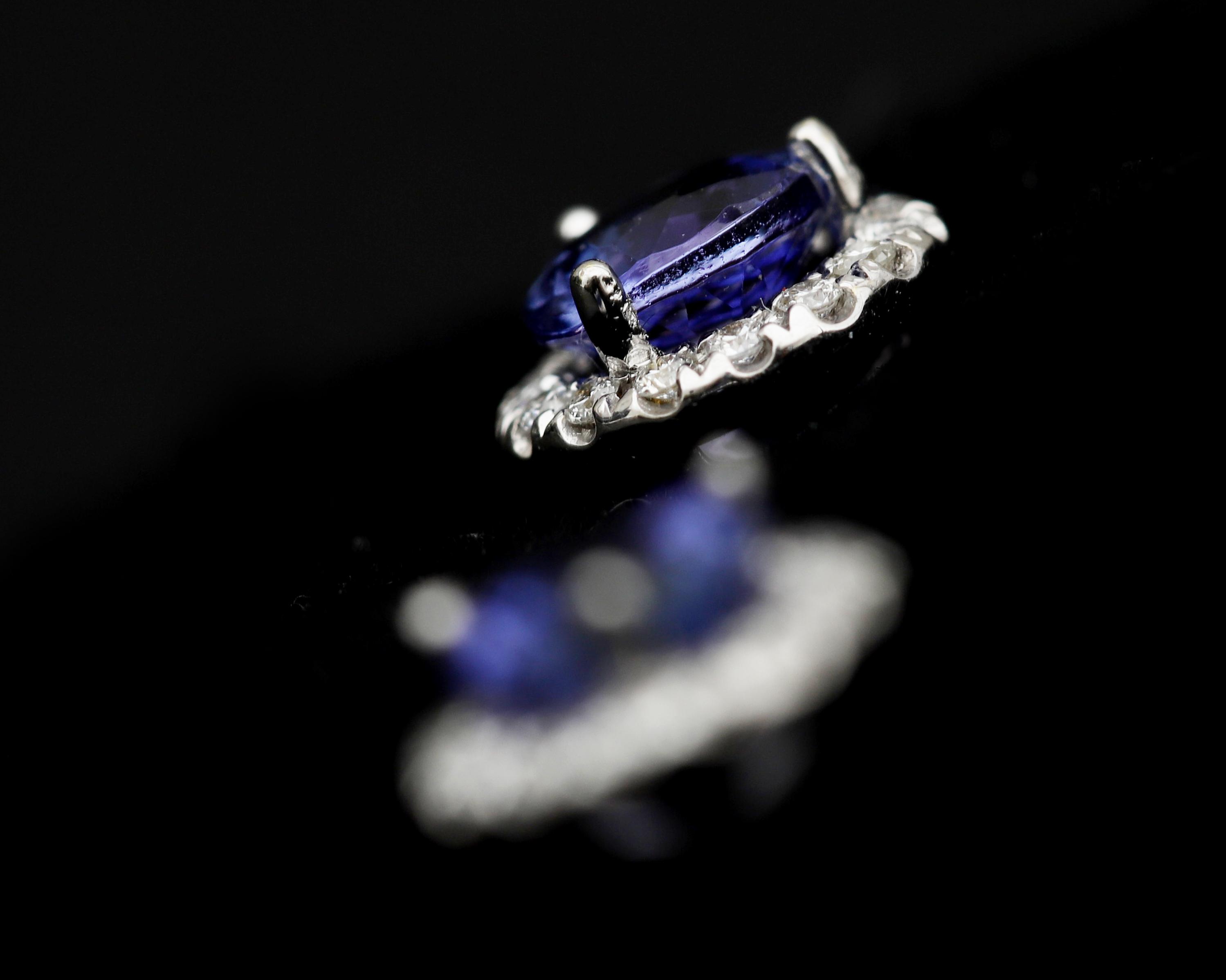 A pair of 18 karat white gold rosette stud earrings, with Tanzanite and diamonds - Image 2 of 2