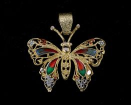 An 18 karat gold pendant in the shape of a butterfly