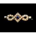 A 14 karat gold brooch, from the mid 19th century, with pearls and sapphire