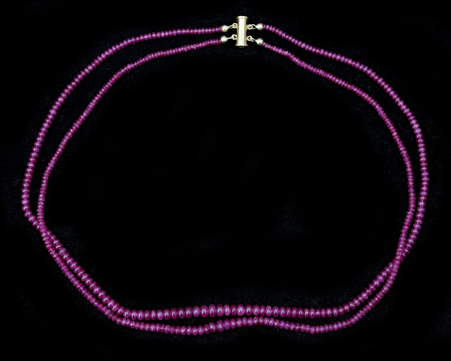 A double strung string of rubies on 18 karat gold magnetic lock