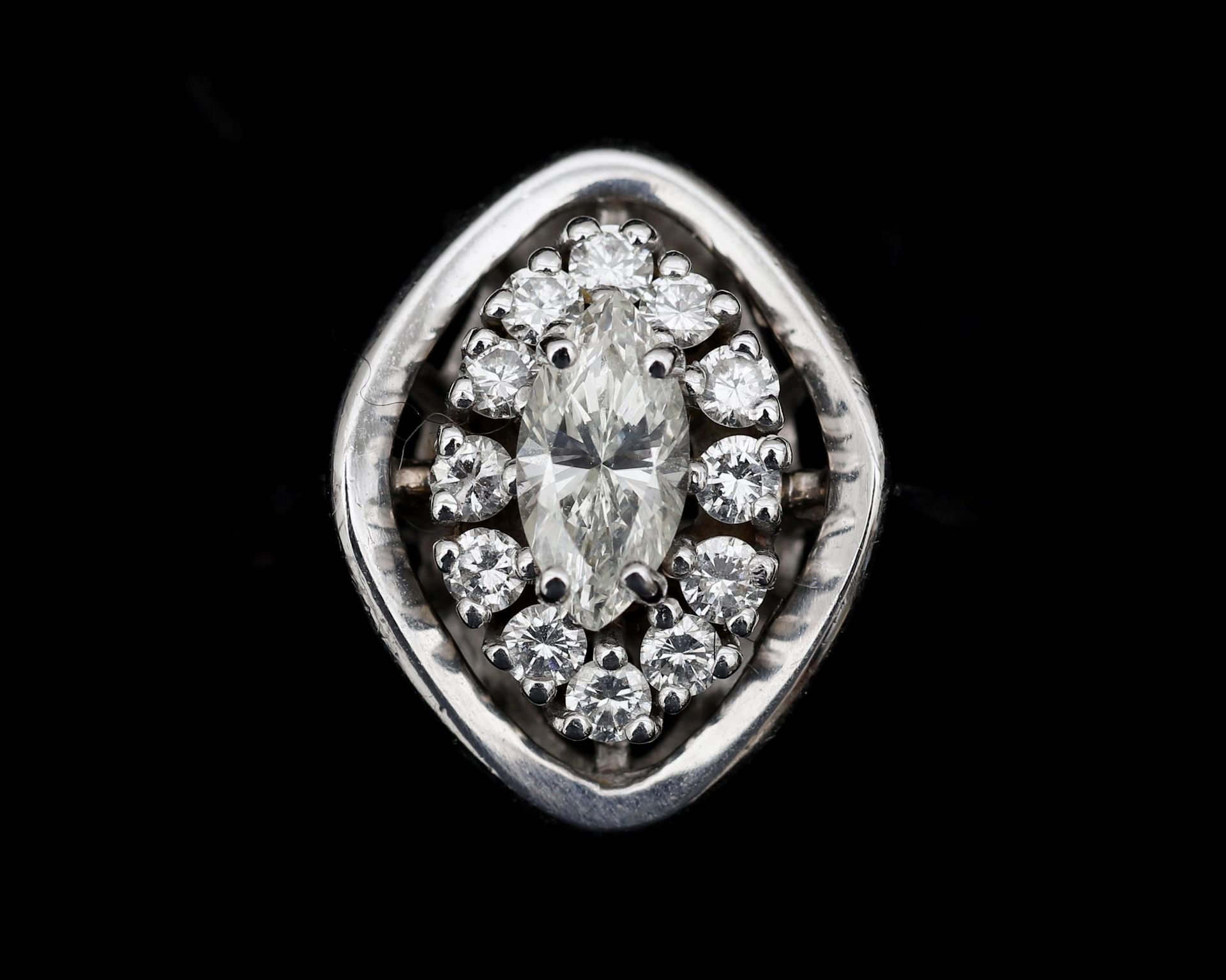 A 14 karat white gold entourage ring in art deco style set with diamonds