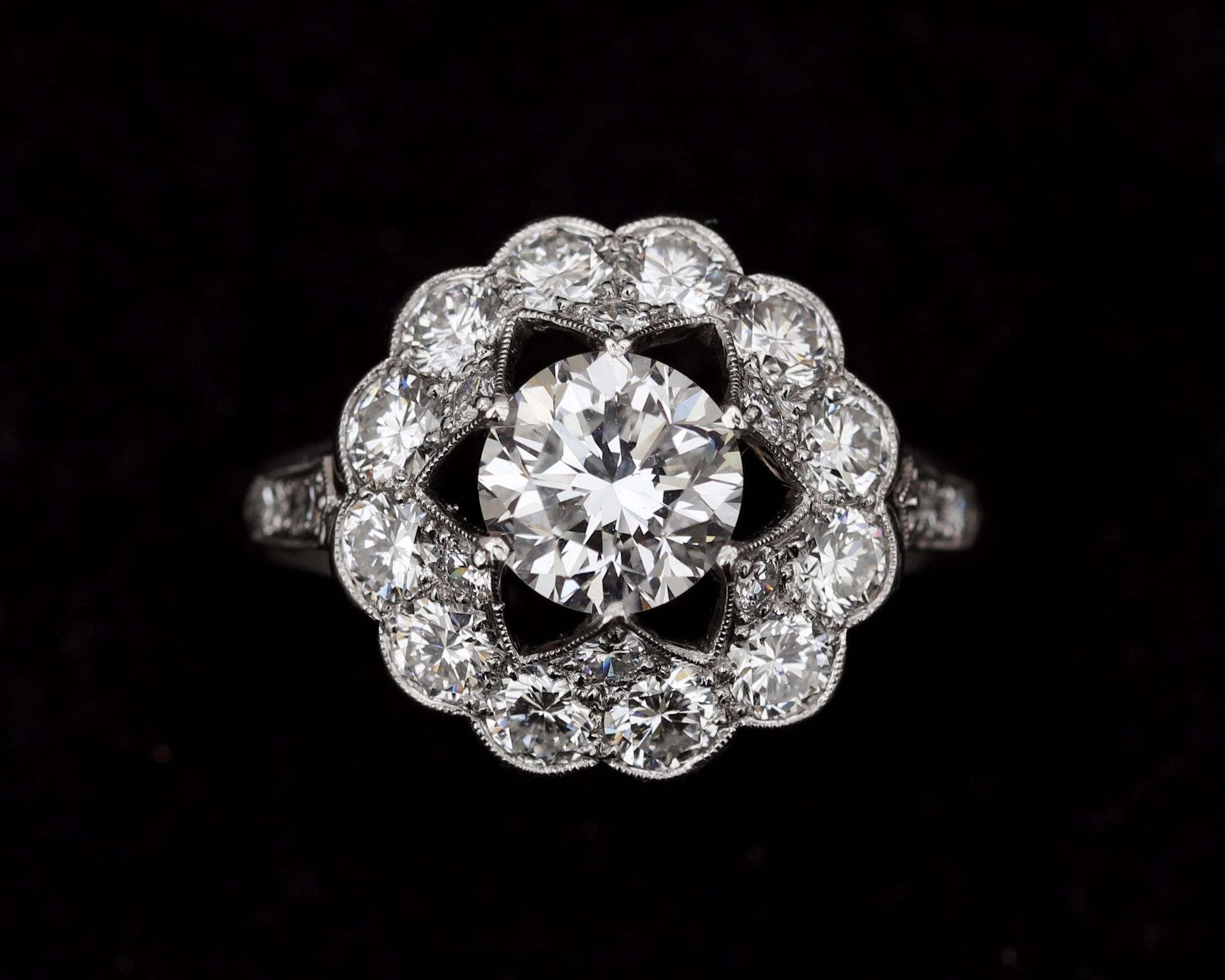 A 14 karat white gold with platinum rosette ring, set with diamonds, in total approx. 2.21ct.