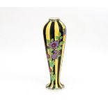 Charles Catteau (1880-1966) A tall black and yellow glazed ceramic vase decorated with branches of