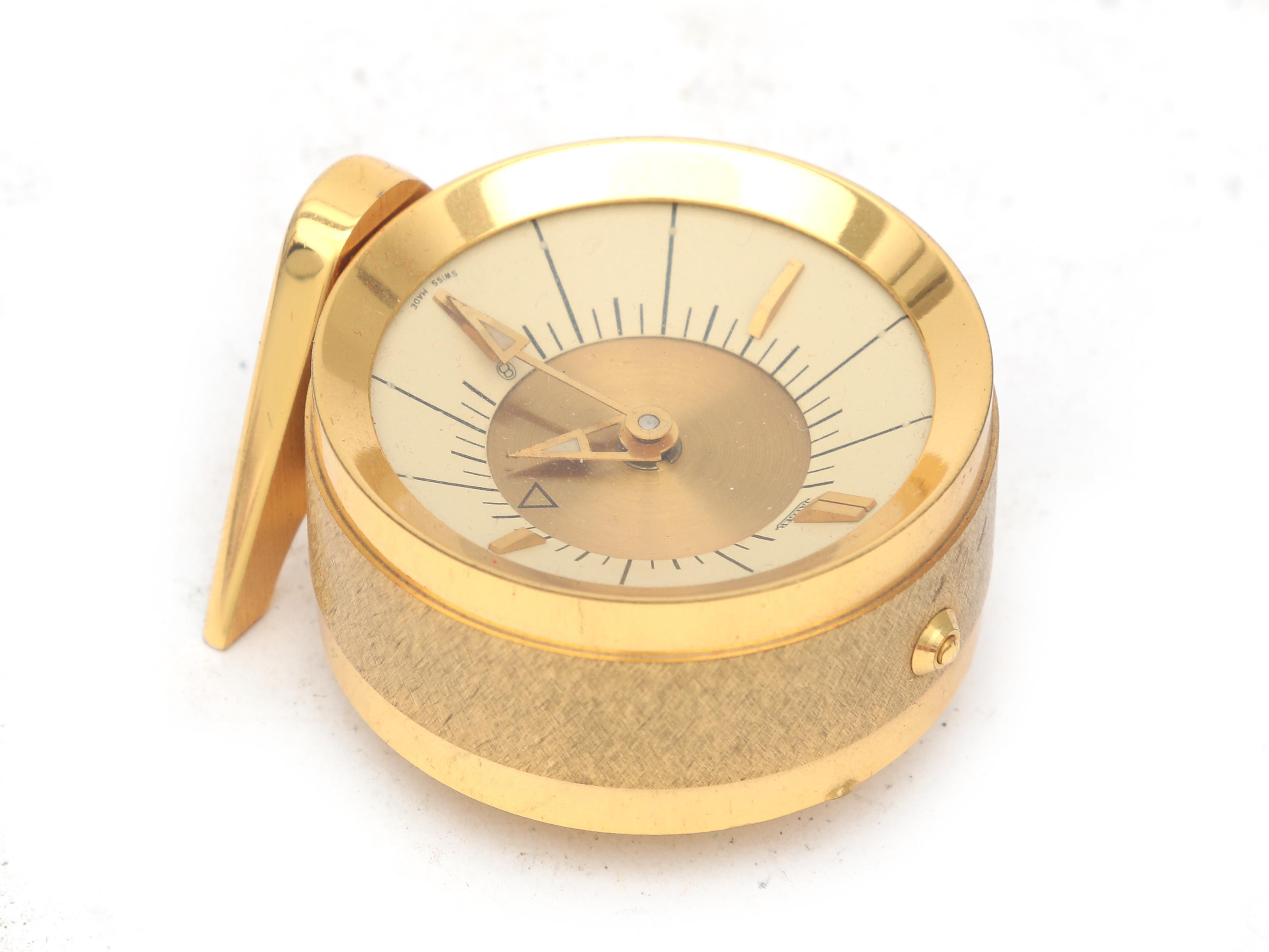 Jaeger A gilt brass travel alarm clock in red box, midcentury, marked to the dial. 5 cm. h. - Image 4 of 5