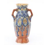 Fayence- en Tegelfabriek Holland, Utrecht An octagonal ceramic vase with two handles, decorated in