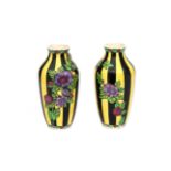 Charles Catteau (1880-1966) Two black and yellow glazed ceramic vases decorated with branches of