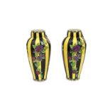 Charles Catteau (1880-1966) Two tall black and yellow glazed ceramic vases decorated with branches