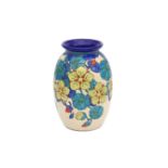Boch Frères, La Louvière A glazed ceramic vase decorated with colourful stylized floral pattern