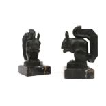 Max Le Verrier (1891-1973) A pair of bronzed metal bookends on black marble bases, both with moulded