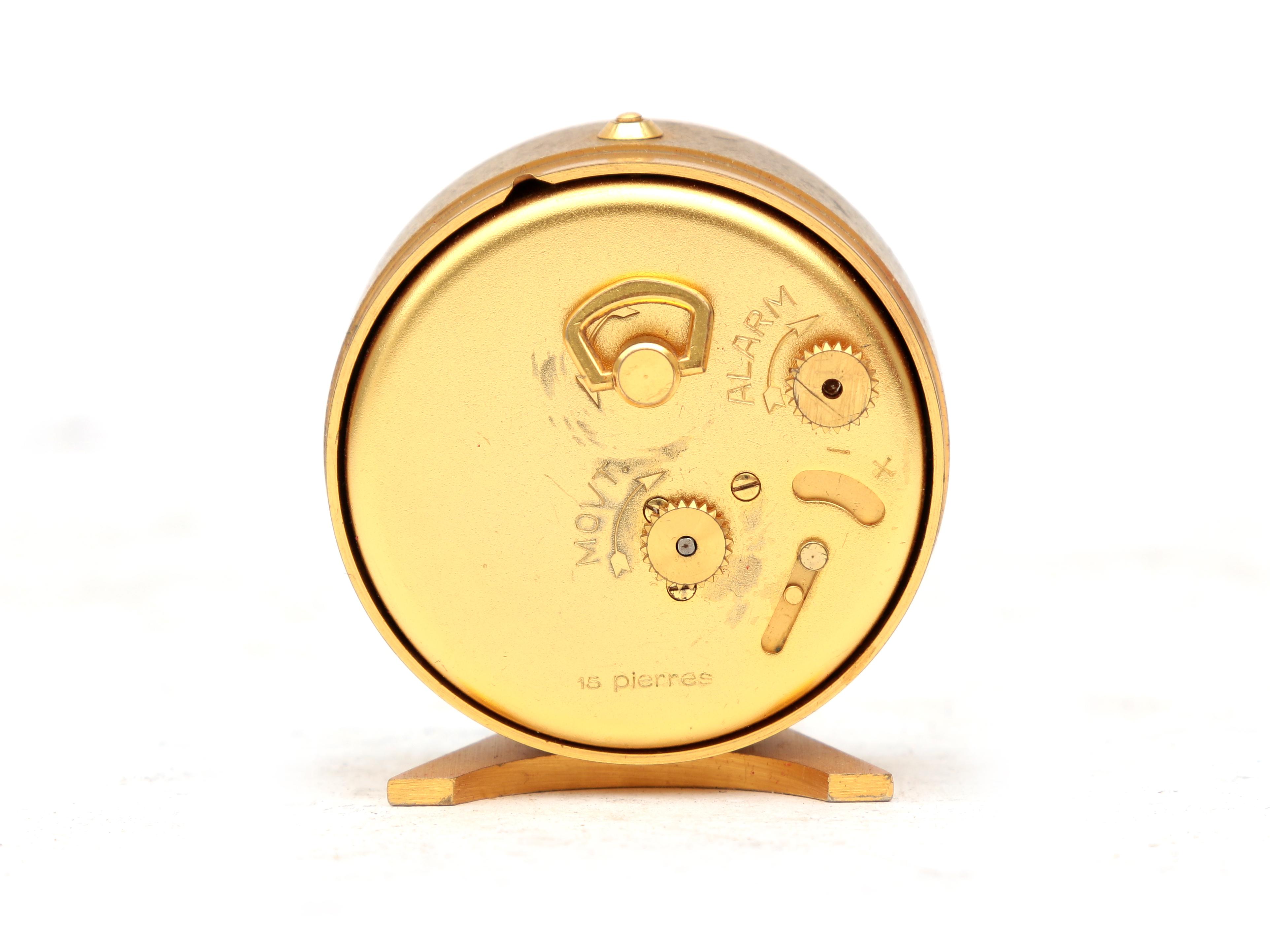 Jaeger A gilt brass travel alarm clock in red box, midcentury, marked to the dial. 5 cm. h. - Image 2 of 5