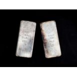 Two kilo bars of silver manufactured by Argor-Chiasso. Numbered: 50191 and 114886, stamped with a