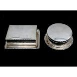 A set of two silver biscuit boxes on matching stands, Dutch, 20th century. A round and rectangular
