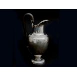 A silver ewer, Dutch, 19th century. Cast with acanthus leafs and with blackened wooden handle.