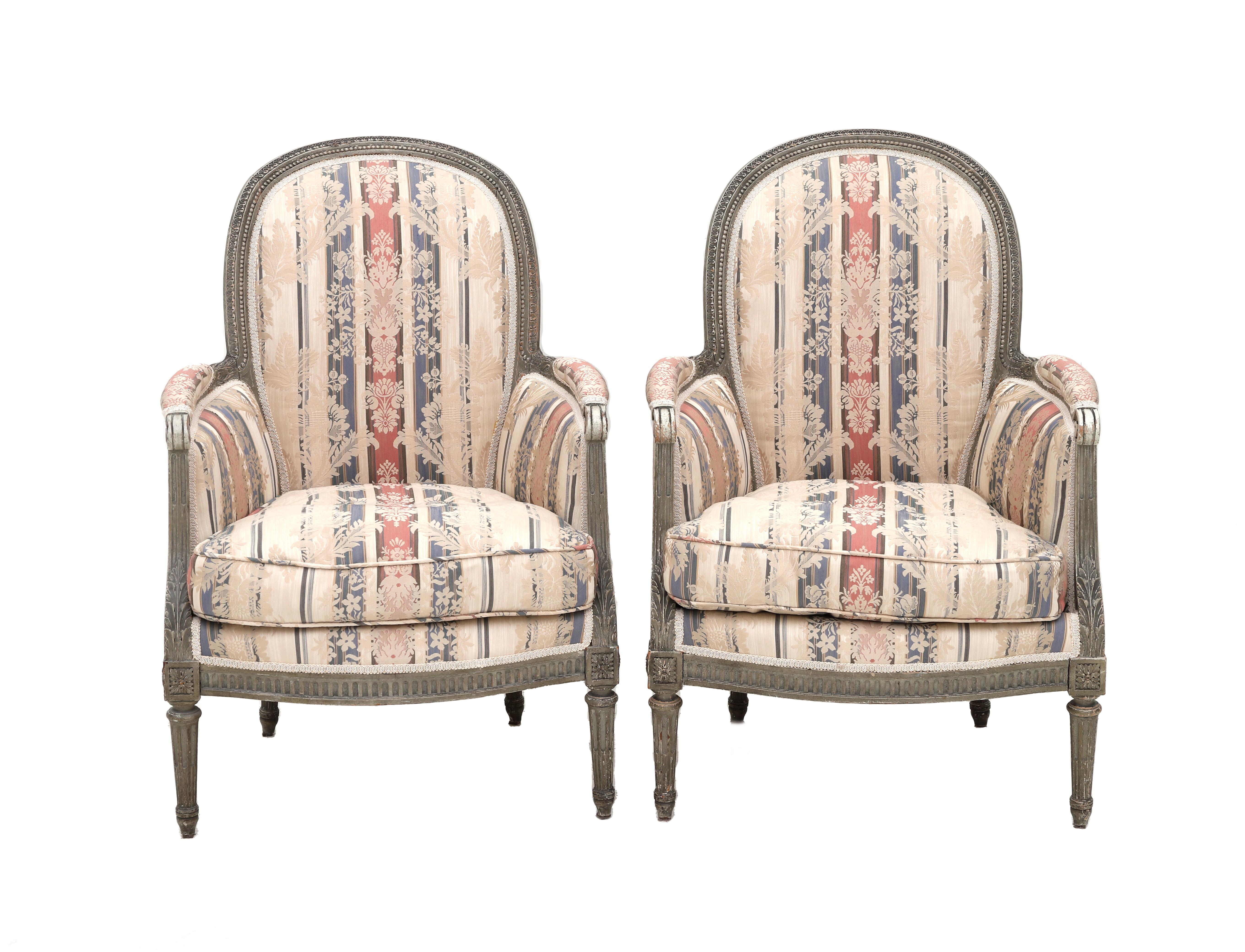 A set of two Louis XVI-style armchairs, England, 19th century. The curved back with vcarved