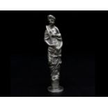 A silver stamp, Dutch, 19th/ 20th century. Shaped as an allegorical figure 'Justice. Hoogte 11 cm.