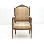 A Bergère in the Louis XVI style from France from the 19th century. Backrest topped with carved